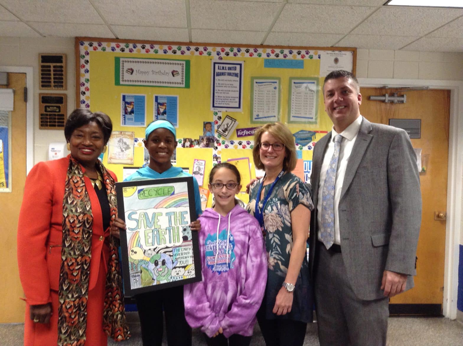 Senator, Olivia Moxey, Lilliana Mandras (another Albert Leonard Middle School student who participated), Art Teacher Sarah Glickman and Alms Principal John Barnes