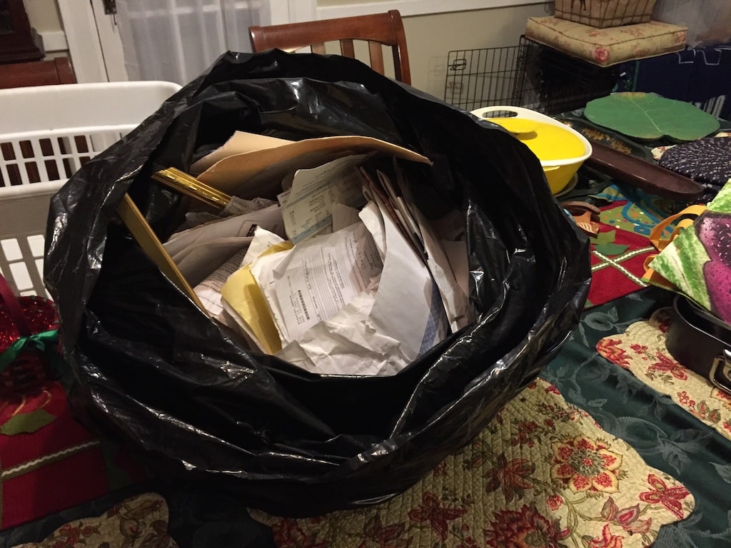 Trash bag full of records throw into street in front of 384 North Avenue