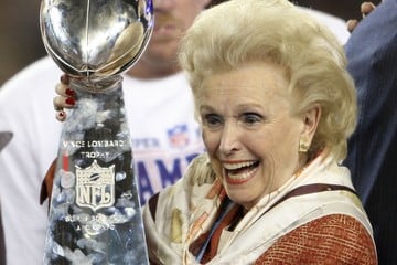 Ann Mara hoists the Lombardi Trophy
