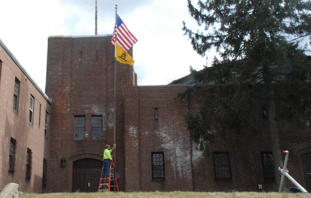 Gadsden Flag being removed from New Rochelle Armory in March 2013