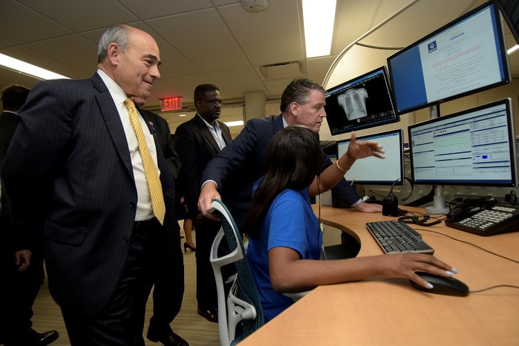 Watching nurse Shantelle Fleury, R.N. demonstrate the new WMCHealth eHealth system are, from left, WMCHealth President and CEO Michael Israel, New York State Senator Terrence Murphy and Westchester County Legislator Ken Jenkins