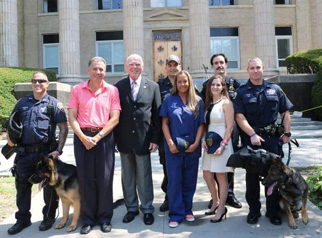 Front Row (Left to Right): P.O Mark Weinerman with Police Canine Tank, City Manager Chuck Strome, Police Commissioner Patrick Carroll, Jennifer Ubl, Jessica Levine, P.O Matthew Glass with Police Canine Valor Back Row (Left to Right):  Lt. Collins Coyne an