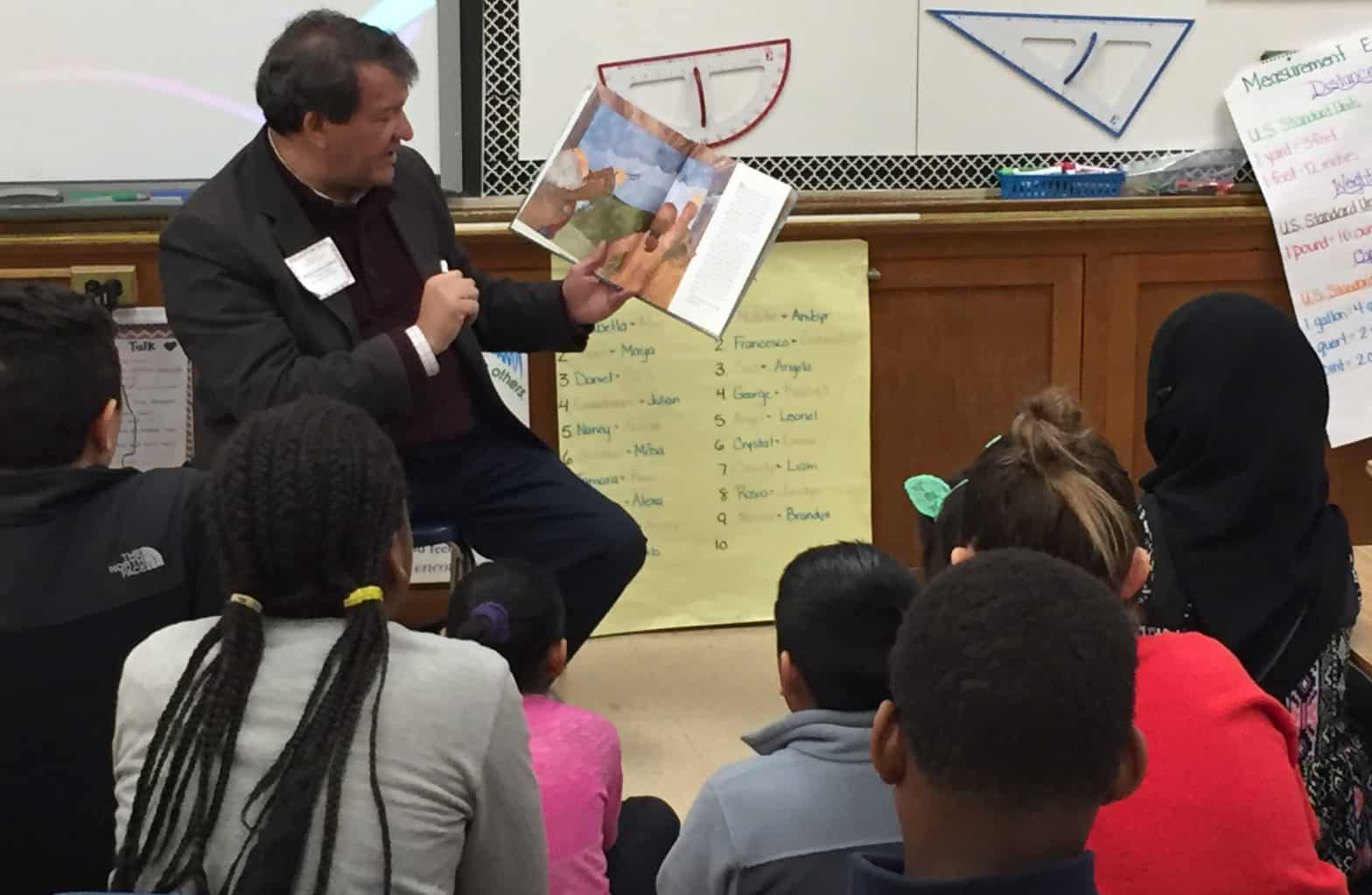 State Senator George Latimer reads to children