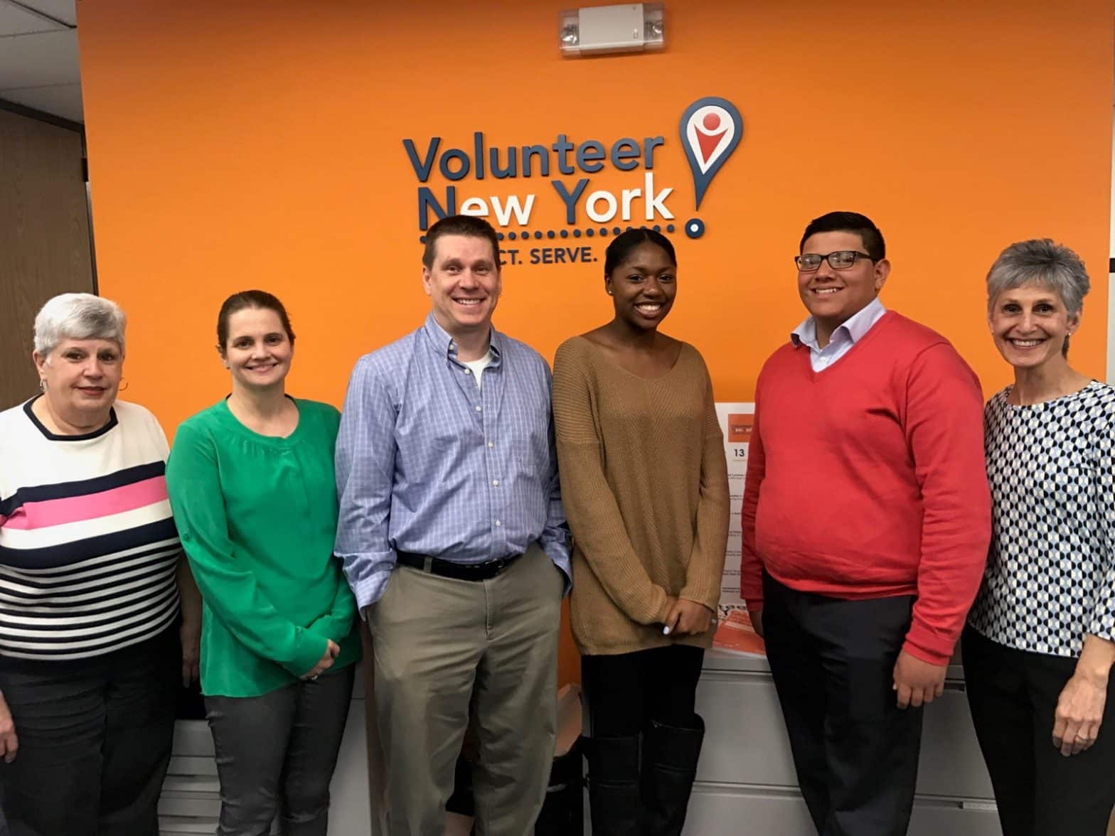Students Francisco Maldonado and Danazsia Bobbitt with executives at Volunteer New York!