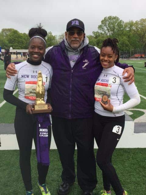 Olivia Morgan (left) and Jeanneney Currie (right) pose with their coach, Andy Capellan (center)