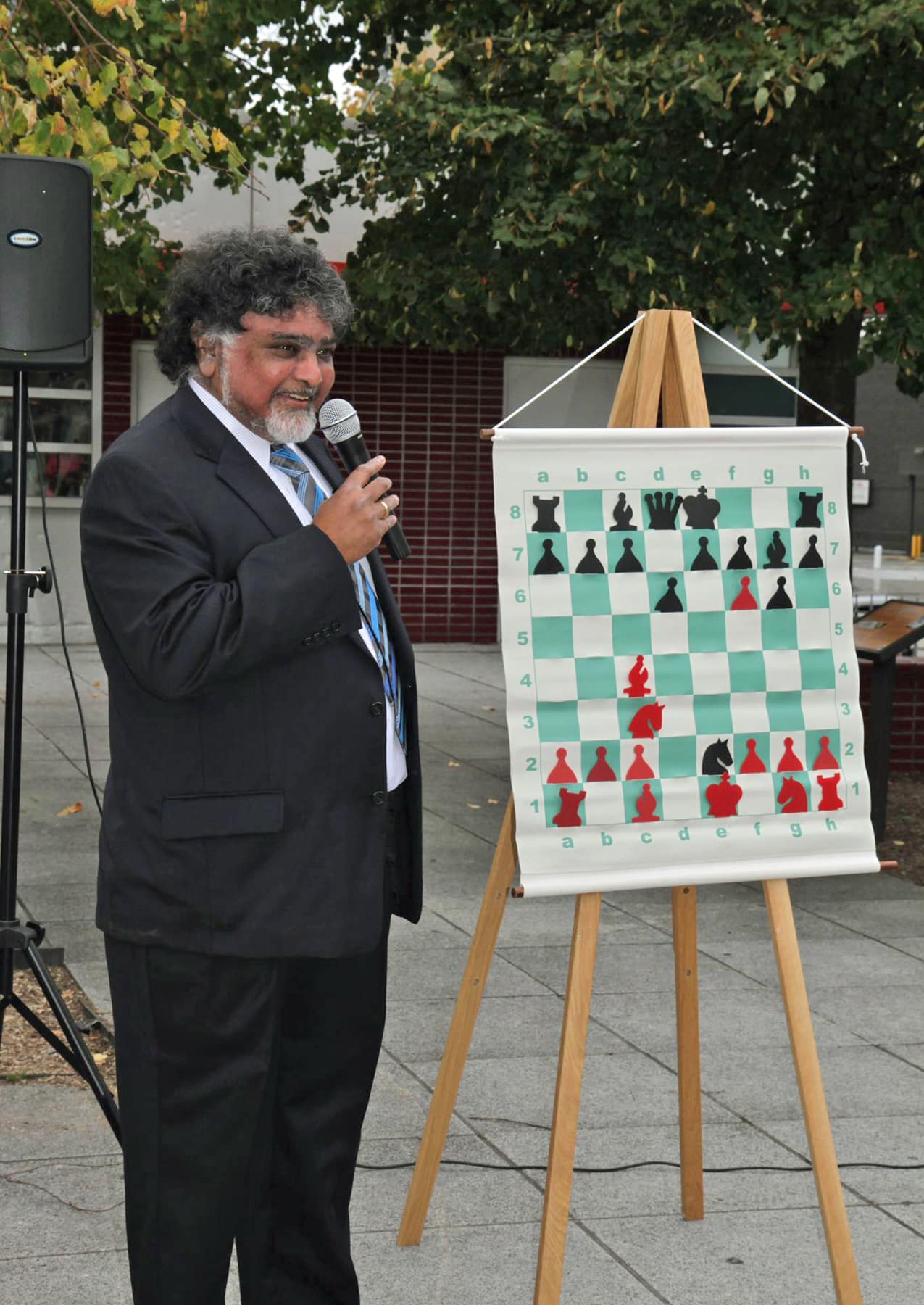Sunil Weeramantry, Executive Director of the National Scholastic Chess Foundation, delivers a lecture as part of Chess in the Park being held on Columbus Day at the New Rochelle Library. The free event includes open play for all ages and abilities, a simu