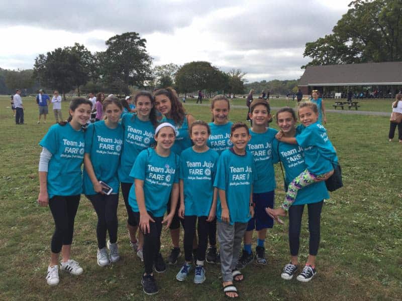 Maria Bulfamante (far right, holding young girl), with friends and family at the Oct. 14 walk.