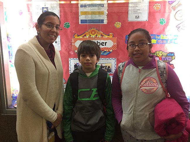 Trinity school counselor Melissa Kelly with Erick Alvarez and Catalina Fuentes.