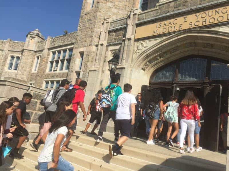 Seventh-graders streaming into Isaac E. Young Middle School for orientation.