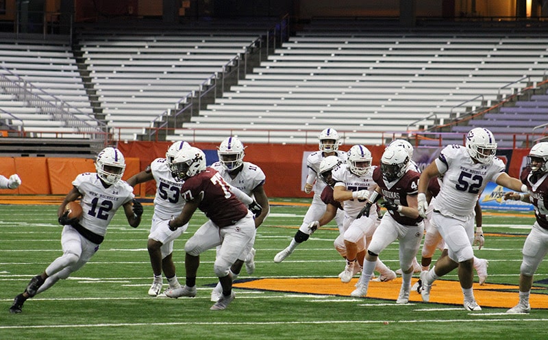 Jessie Parson runs the football for the Huguenots in the state championship game.