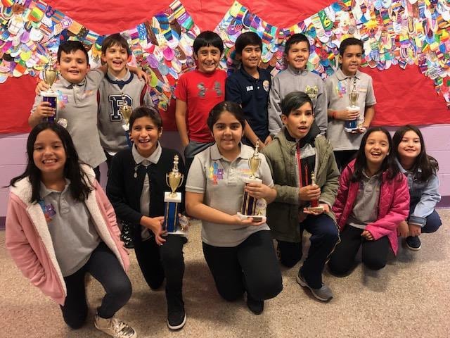 Columbus Chess Team members celebrating their Dec. 1 tournament successes.
