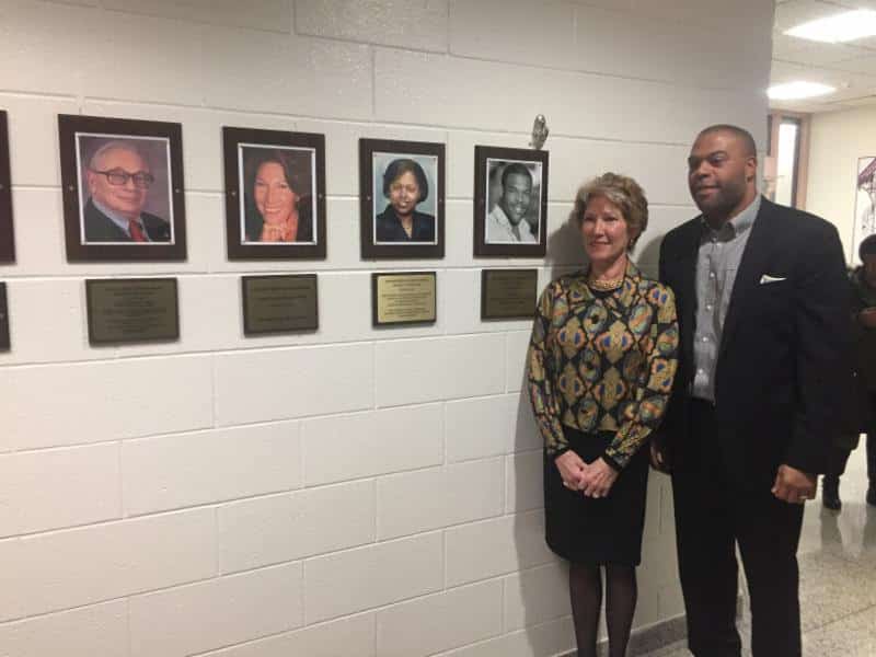 New Wall of Famer inductees Madeline de Vries Hooper and Rasaun N. Young with photos of themselves and the other two four inductees, who could not attend.