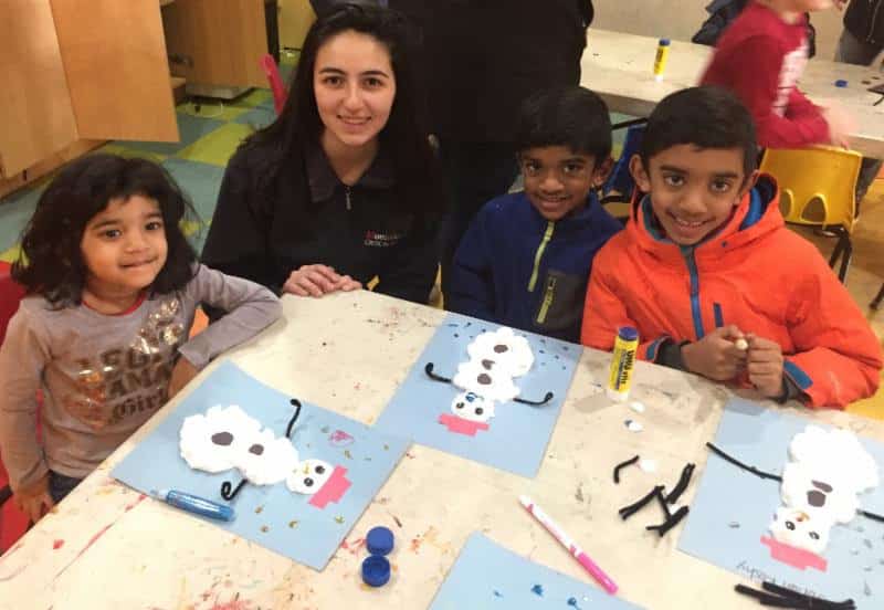 NRHS National Art Honor Society member Sanaz Sadeghi works with participants in the Hands Across Art program.