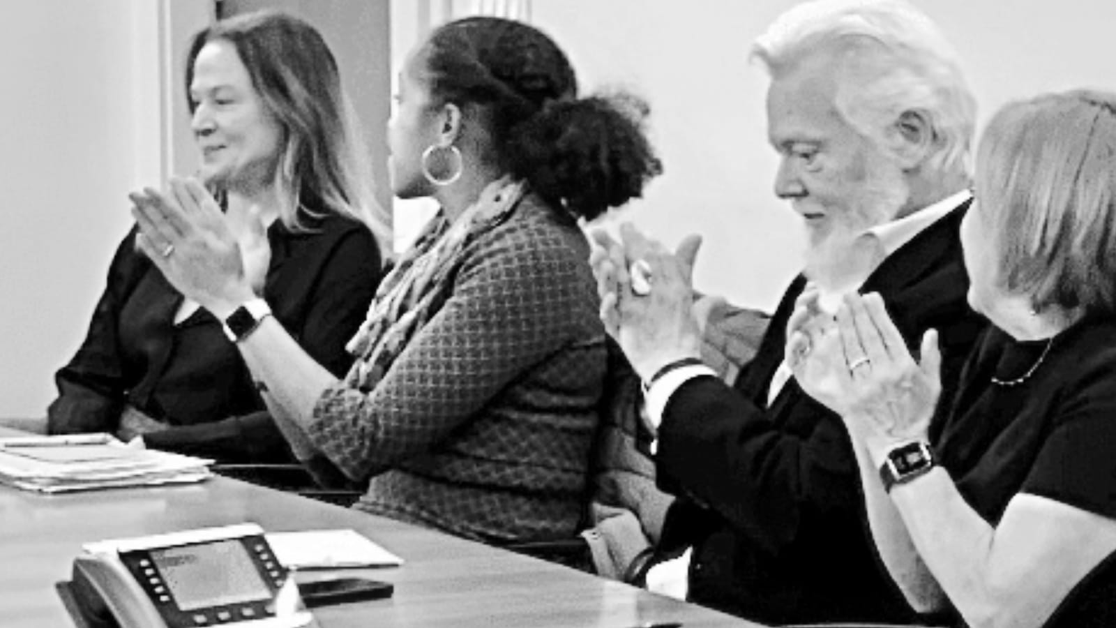Yadira Ramos-Herbert applauds Kathleen Gill after voting to hire Gill as City Manager on November 29, 2022